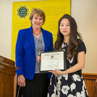 Mary Galvin presents Diane Choi with the Dean's Research Award