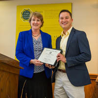 Mary Galvin presents Luke Gray with the Dean's Research Award