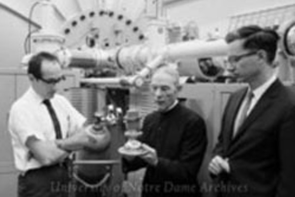 Sperry E. Darden, Brother Cosmas Guttly, and Cornelius P. Browne in front of the new particle accelerator in Nieuwland Science Hall, July 1968