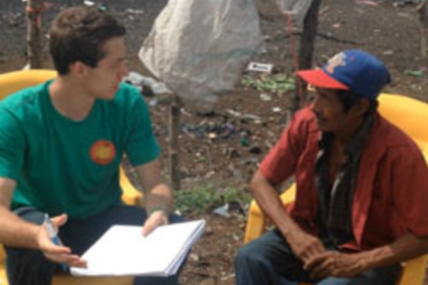 Mark Brahier interviews a garbage dump worker in Nicaragua