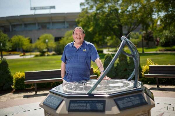 Tim Beers By sundial in front of Jordan Hall