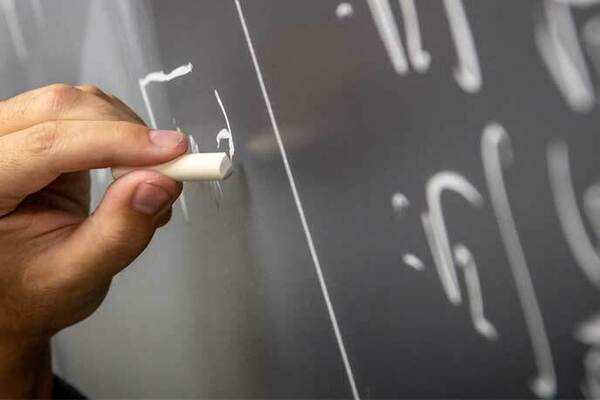 Performing mathematics on chalkboard