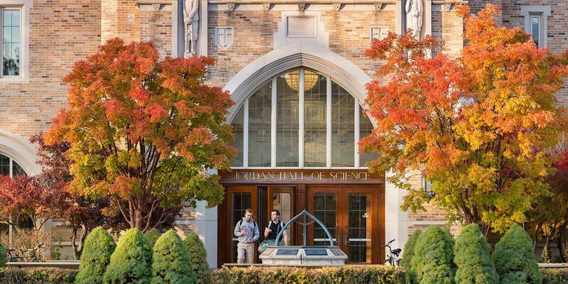 Jordan Hall front doors with trees in fall colors