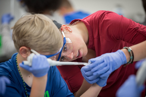 Kids conduct experiments at DNA Learning Camp