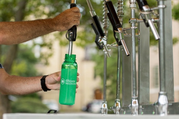 Filling Up Green Water Bottle