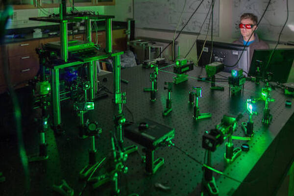 Dark Physics Lab with green glowing lights