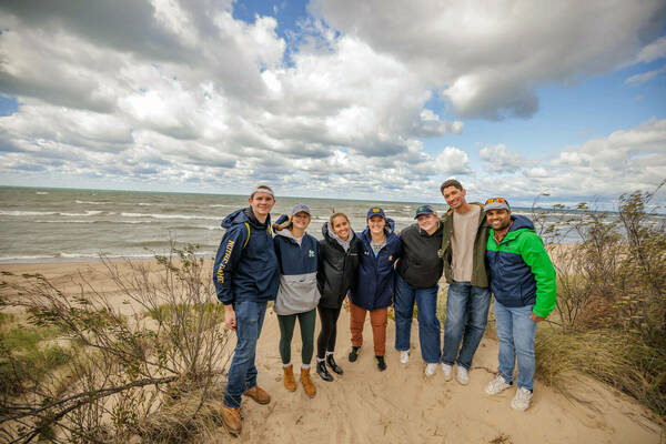 Ecology field trip: group of students on shore of Lake Michigan