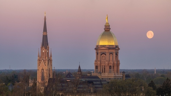 The moon over Golden Dome and Basilica.