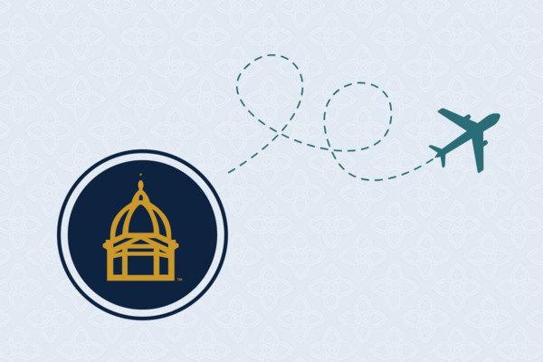 A teal airplane icon follows a dotted line path away from a navy blue circle containing the gold outline of the University of Notre Dame's Main Building, representing travel from the university. A light blue repeating quatrefoil pattern makes up the background.