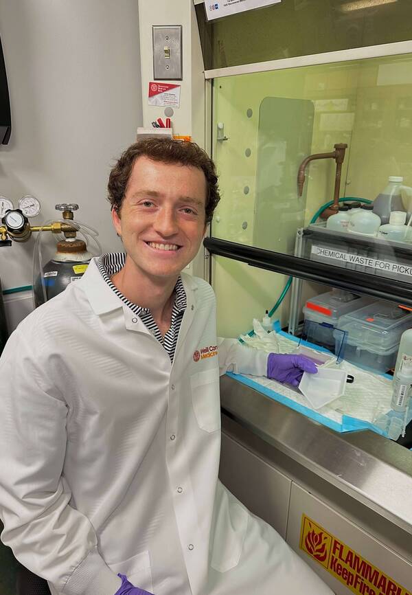 Mason Cohen working in a research lab.