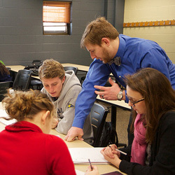 Brian Shourd works with a group in his Calculus III class.
